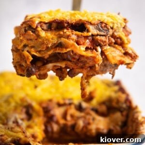 43 Gluten-Free Vegan Recipes for Everyday Meals and Desserts 14 lasagne slice being lifted from baking dish full of lasagne.