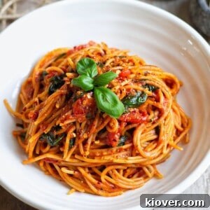 43 Gluten-Free Vegan Recipes for Everyday Meals and Desserts 19 Cherry Tomato Pasta with fresh basil leaves on top.