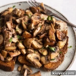 43 Gluten-Free Vegan Recipes for Everyday Meals and Desserts 6 garlic mushrooms on toast with a white plate