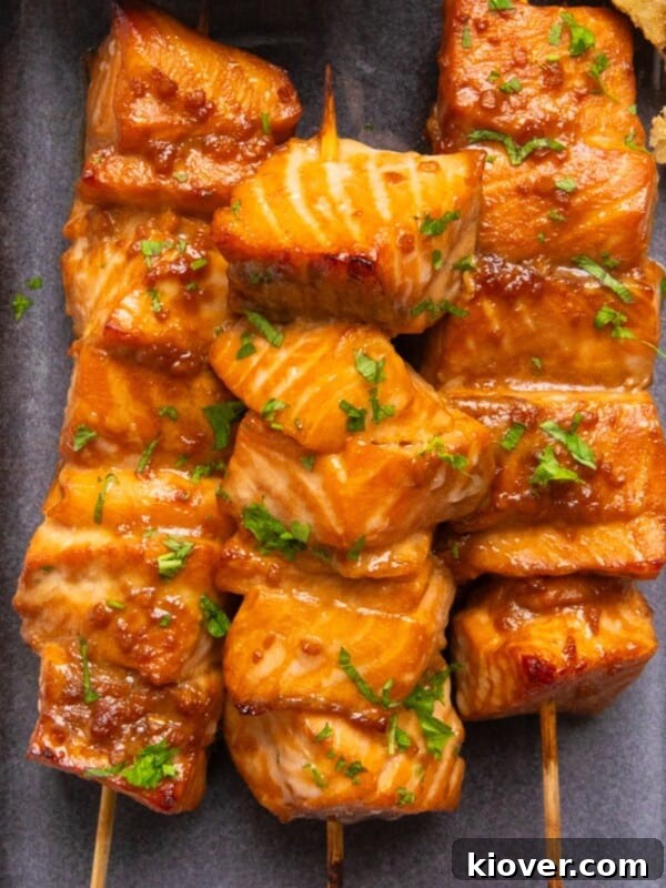 Creamy Salmon Noodle Bowl with Lemon and Dill 12 Asian salmon skewers on a plate.