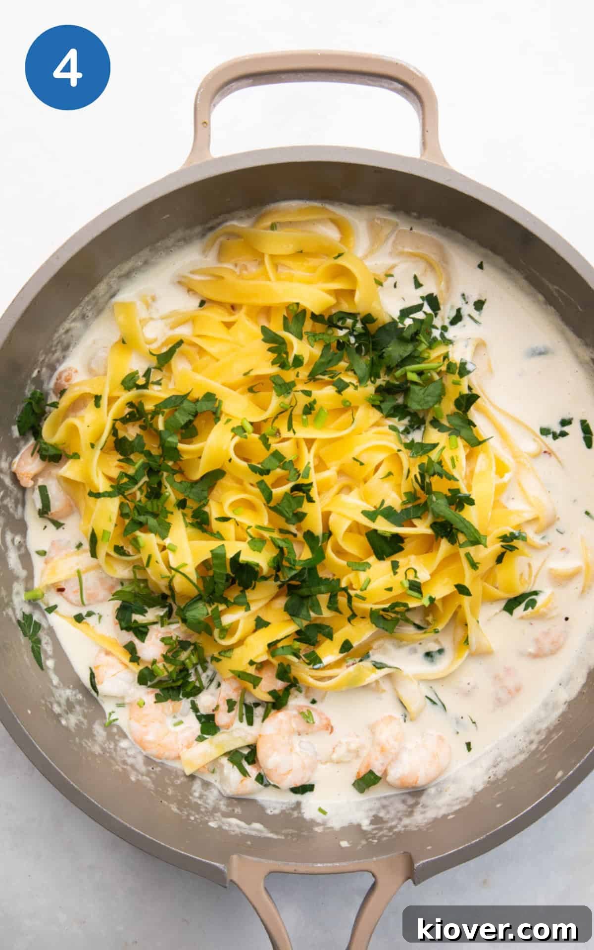 Garlic Prawn Linguine with Lemon and Fresh Parsley 7 adding linguine and fresh parsley to the pan.