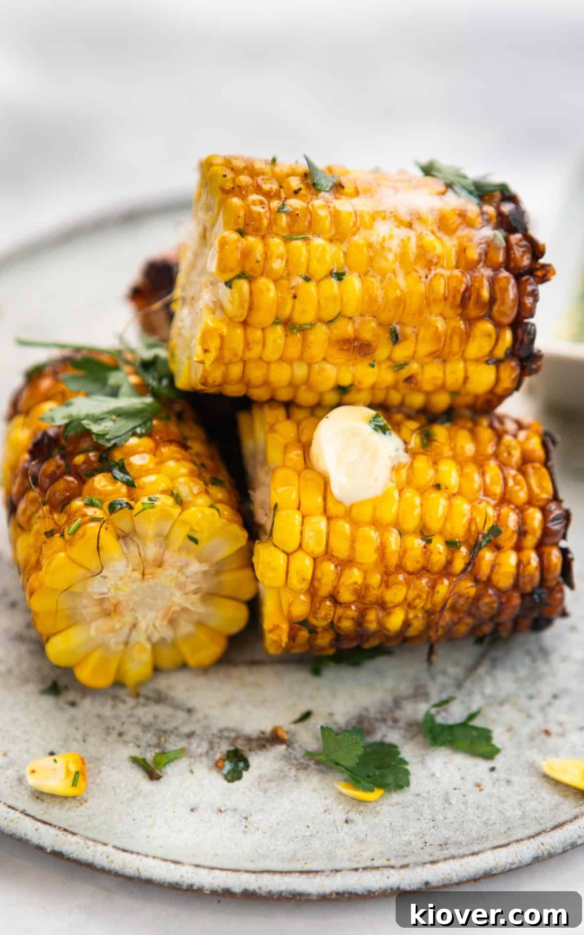 air fryer corn on the cob with butter and sour cream.