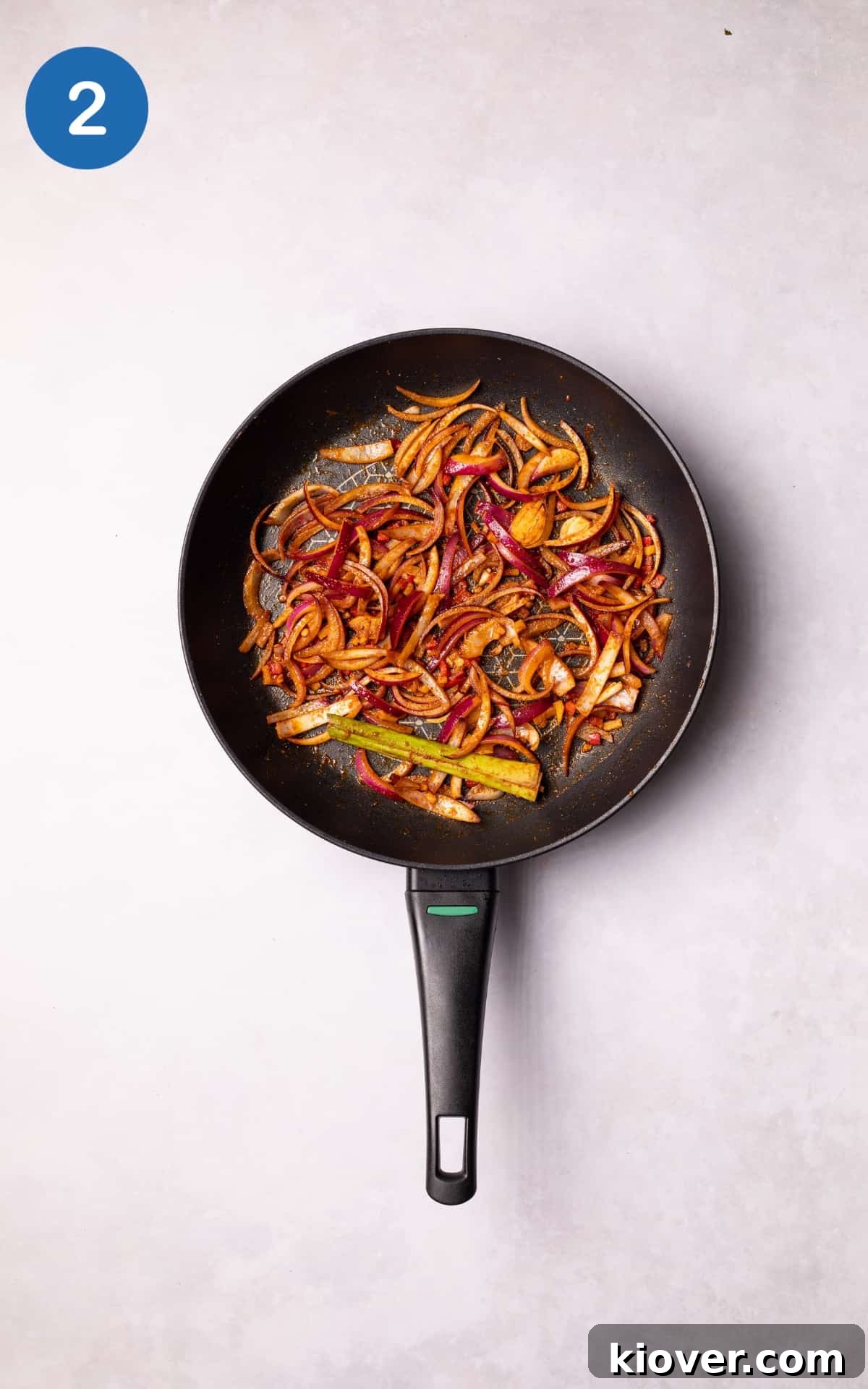 Authentic Vegan Thai Curry Recipe with Creamy Coconut Sauce 5 Vegetables and spices frying in a pan.