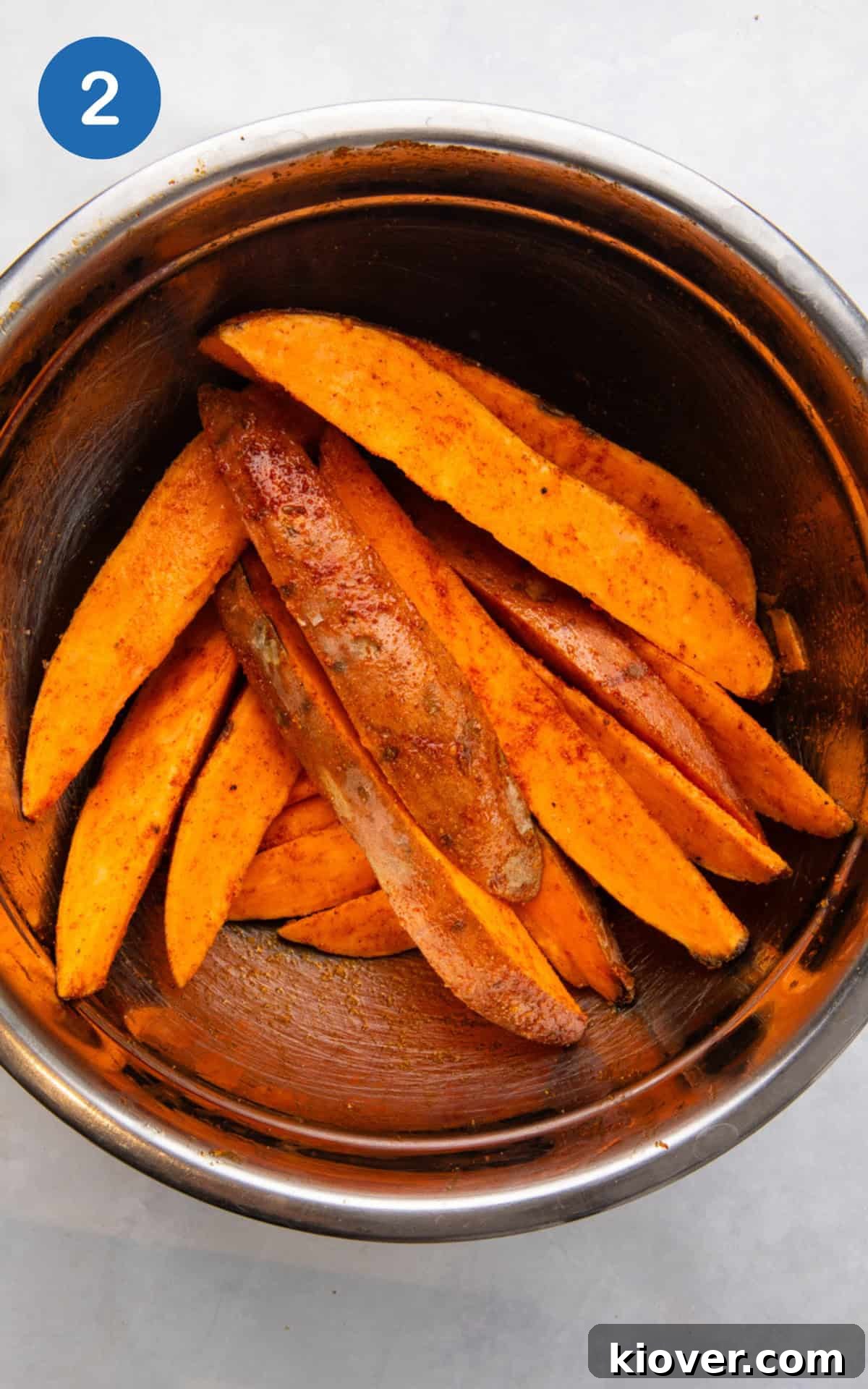 combine the wedges with olive oil, paprika, garlic powder, onion powder, salt, and black pepper.