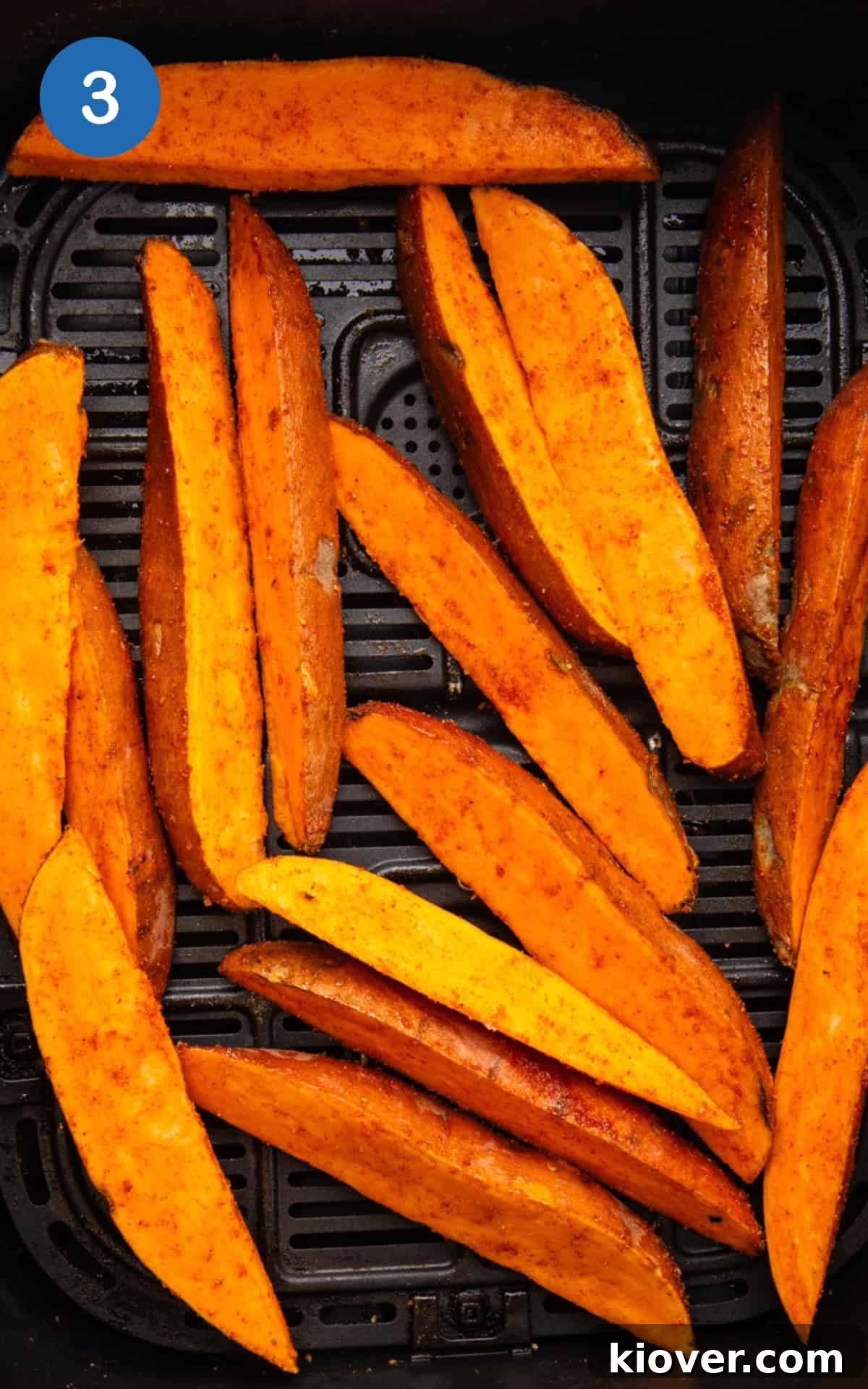 sweet potato wedges in the air fryer basket.