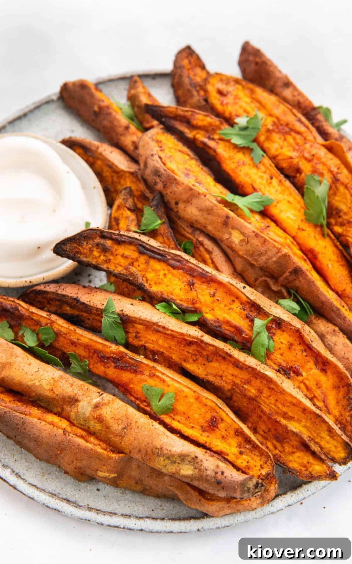 air fried sweet potato garnished with fresh parsley.