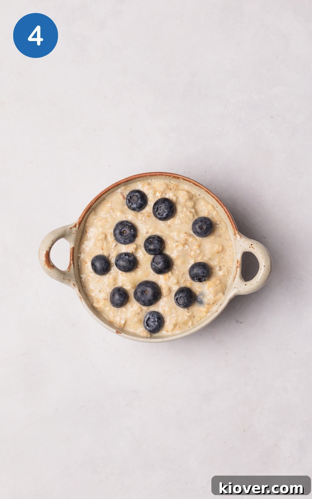 Creamy Baked Oats Recipe for Breakfast and Meal Prep 7 oatmeal mixture poured into an ovenproof ramekin.