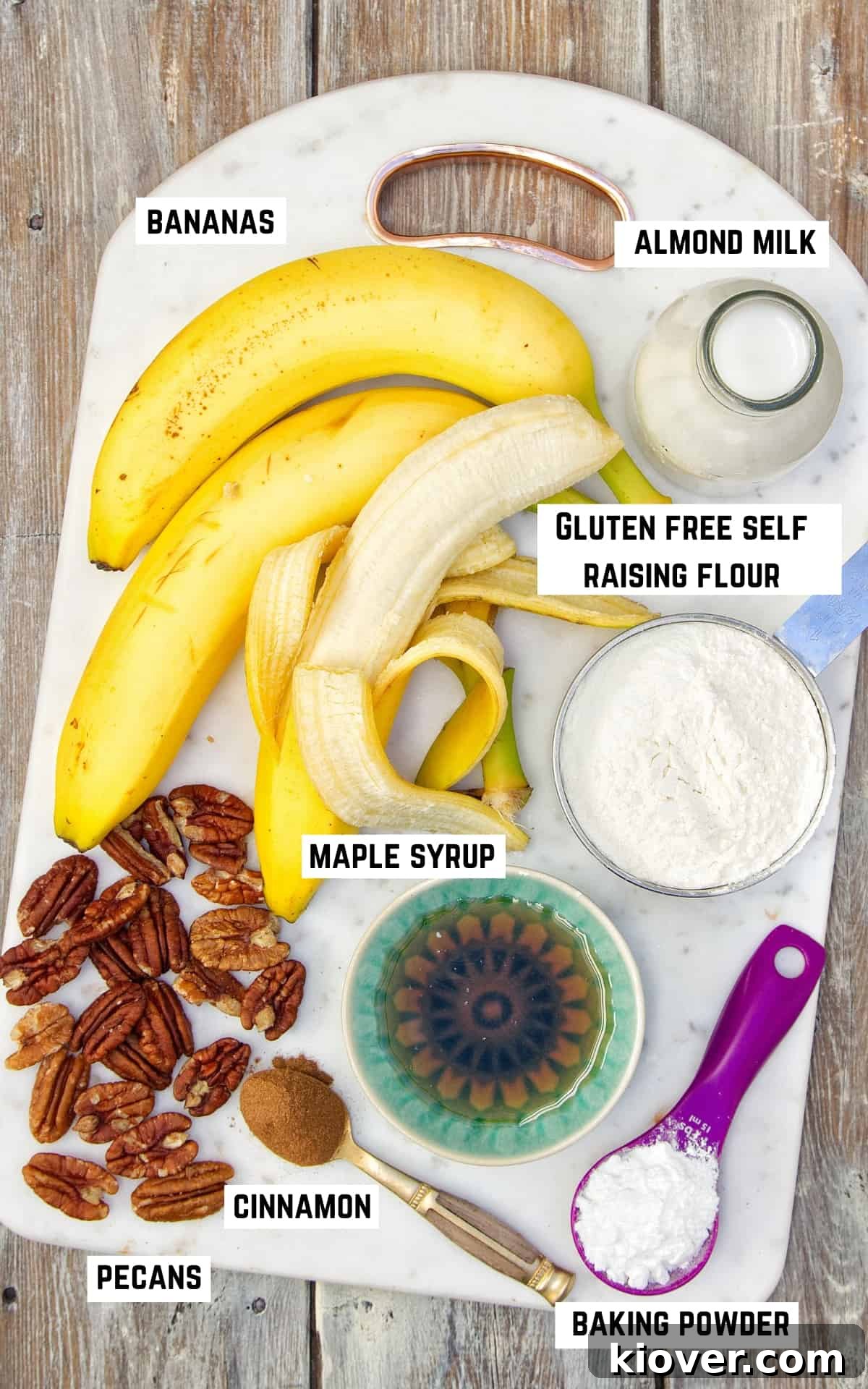Ingredients to make gluten free vegan banana bread laid out on white chopping board.