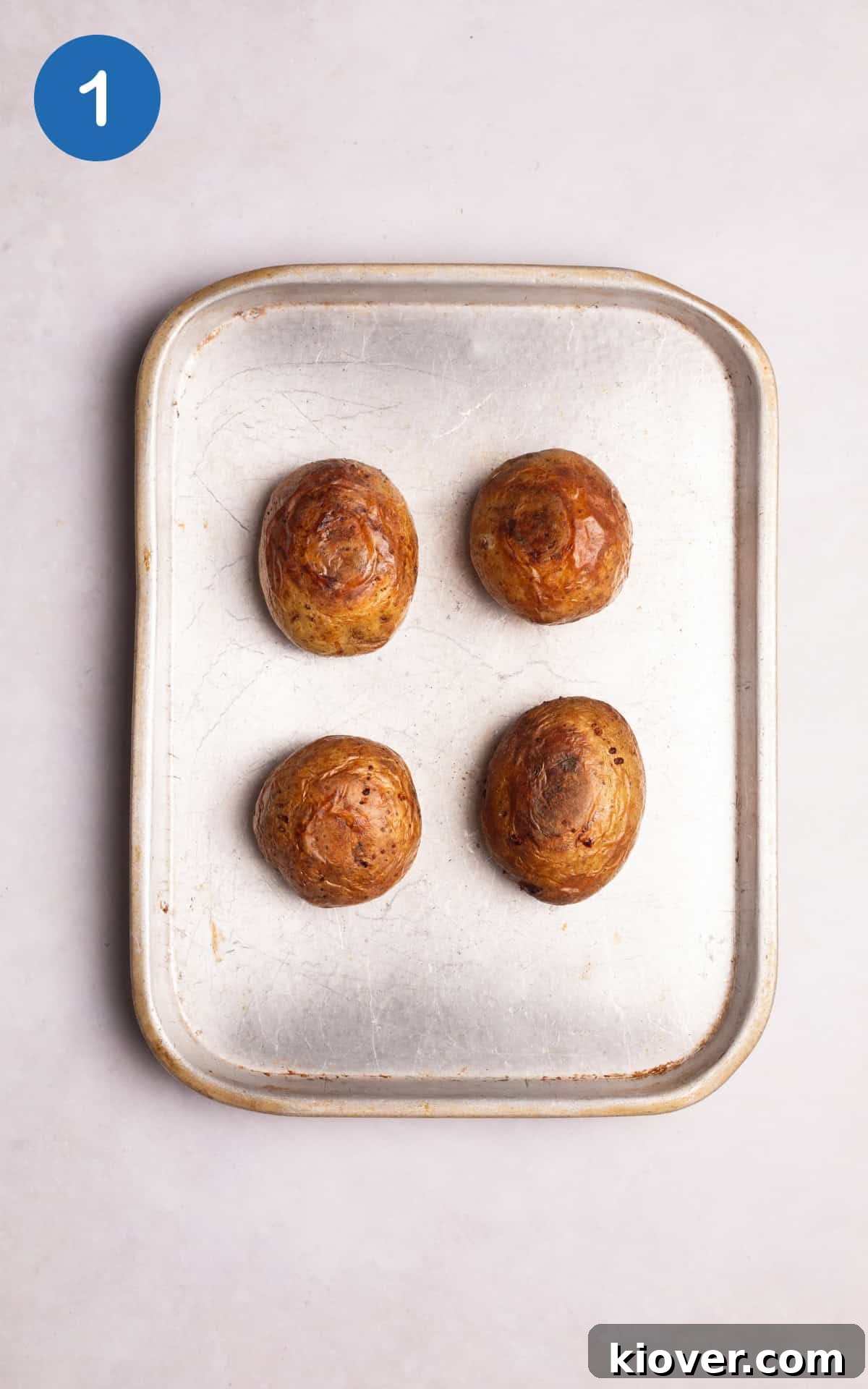 potatoes rubbed in olive oil and placed on a baking tray.