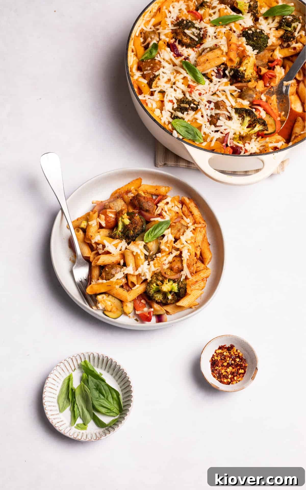 sausage pasta bake served with fresh basil.