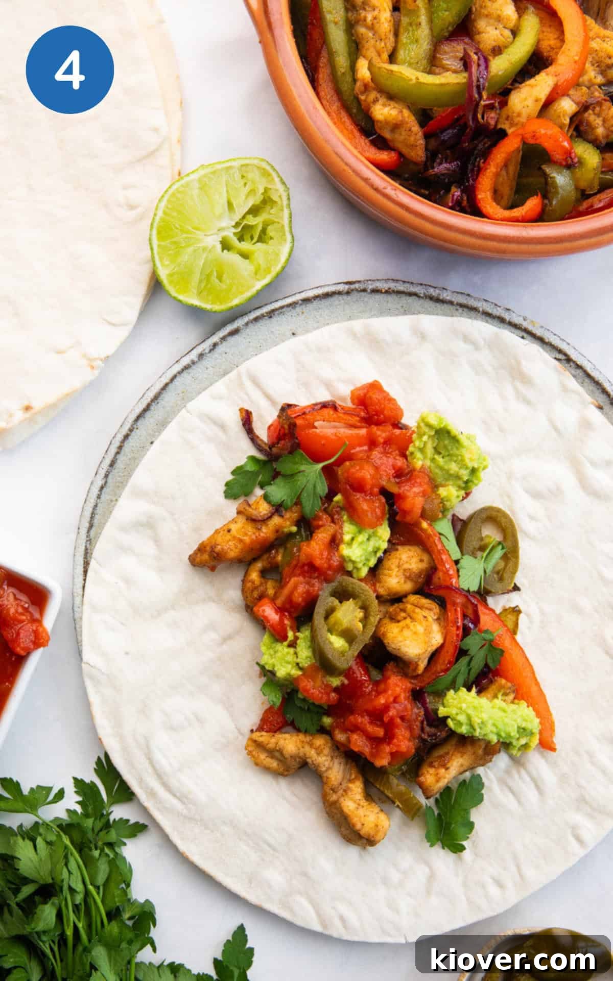 Crispy Air Fryer Chicken Fajitas Recipe for Quick Weeknight Meals 7 air fried chicken and vegetables on a wrap.