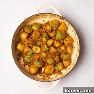 Bombay Aloo (bombay potatoes) garnished with fresh corriander.