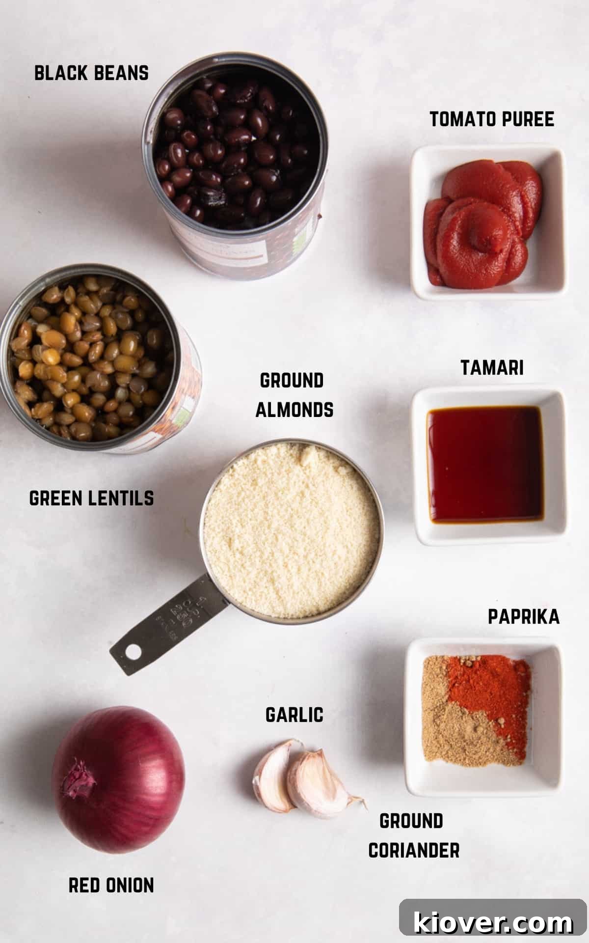 Ingredients to make vegan meat balls on white surface.