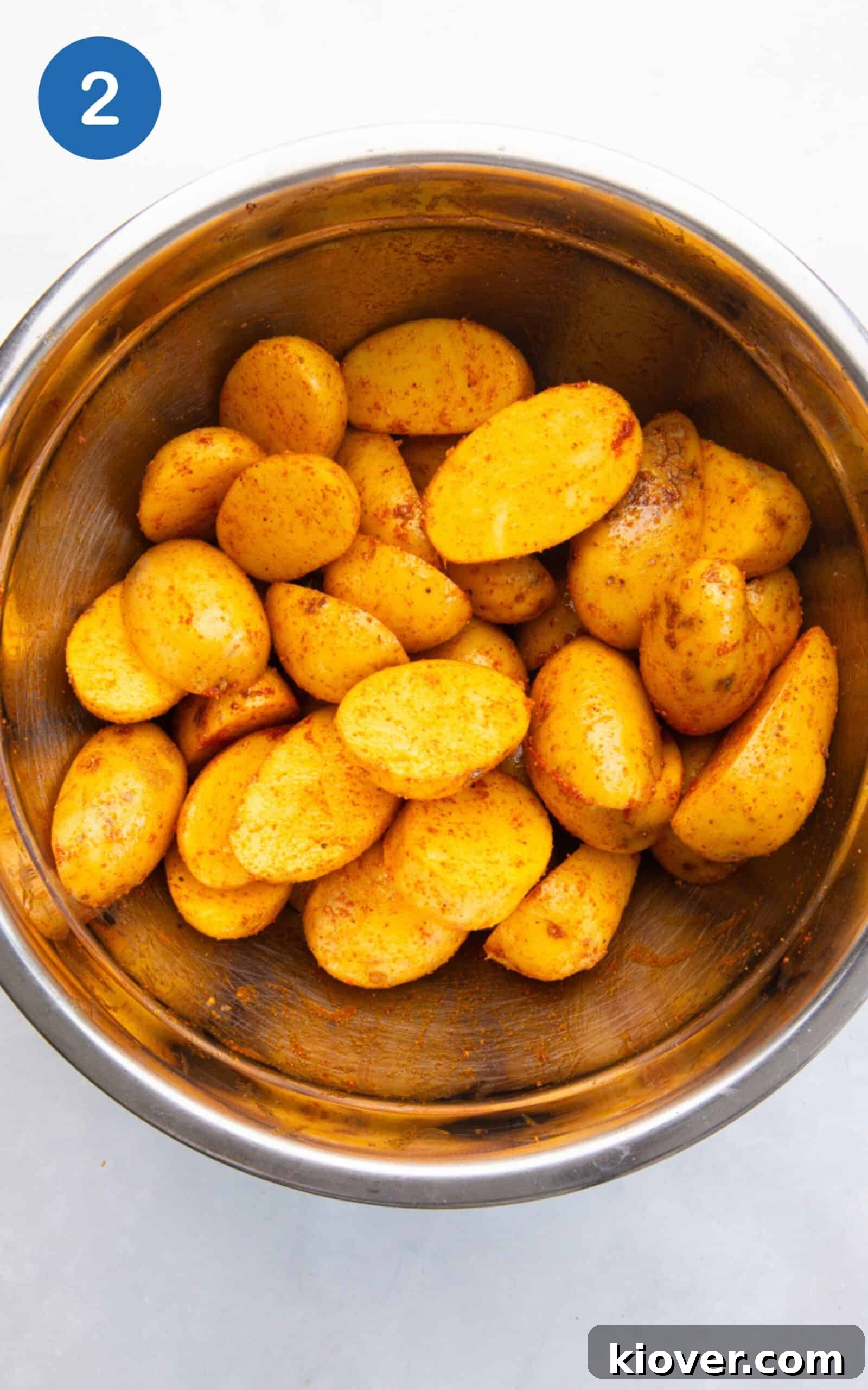 potatoes in a large bowl with the paprika, onion powder, garlic powder, salt and pepper.