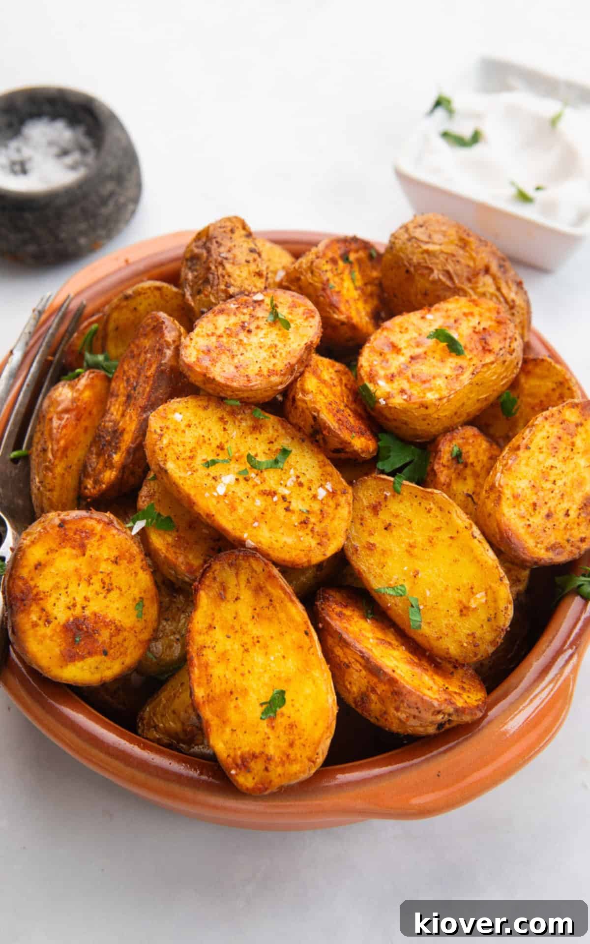 air fryer baby potatoes with fresh parsley on top.