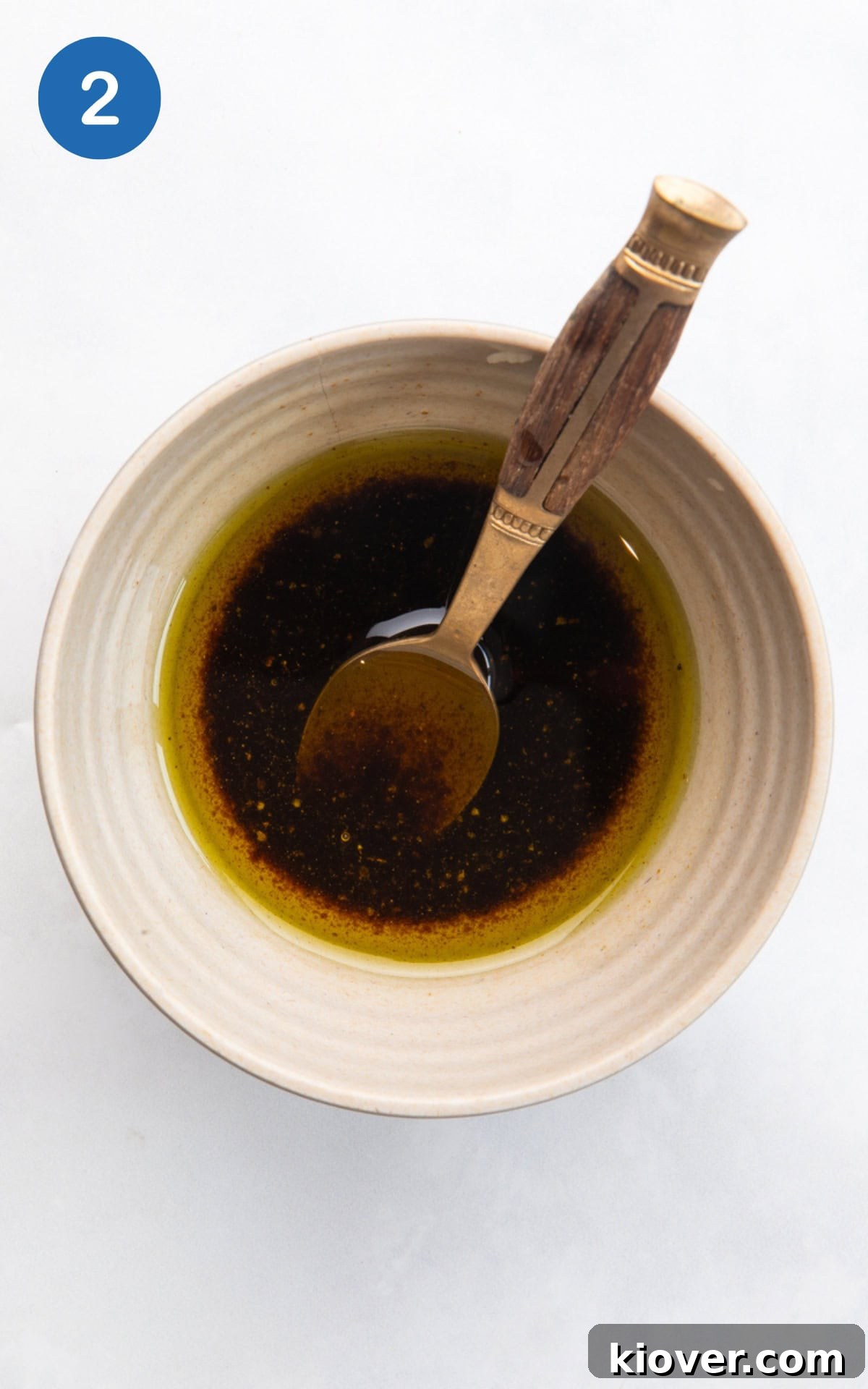 mixing extra virgin olive oil. balsamic vinegar, and a pinch of salt and pepper in a small bowl.