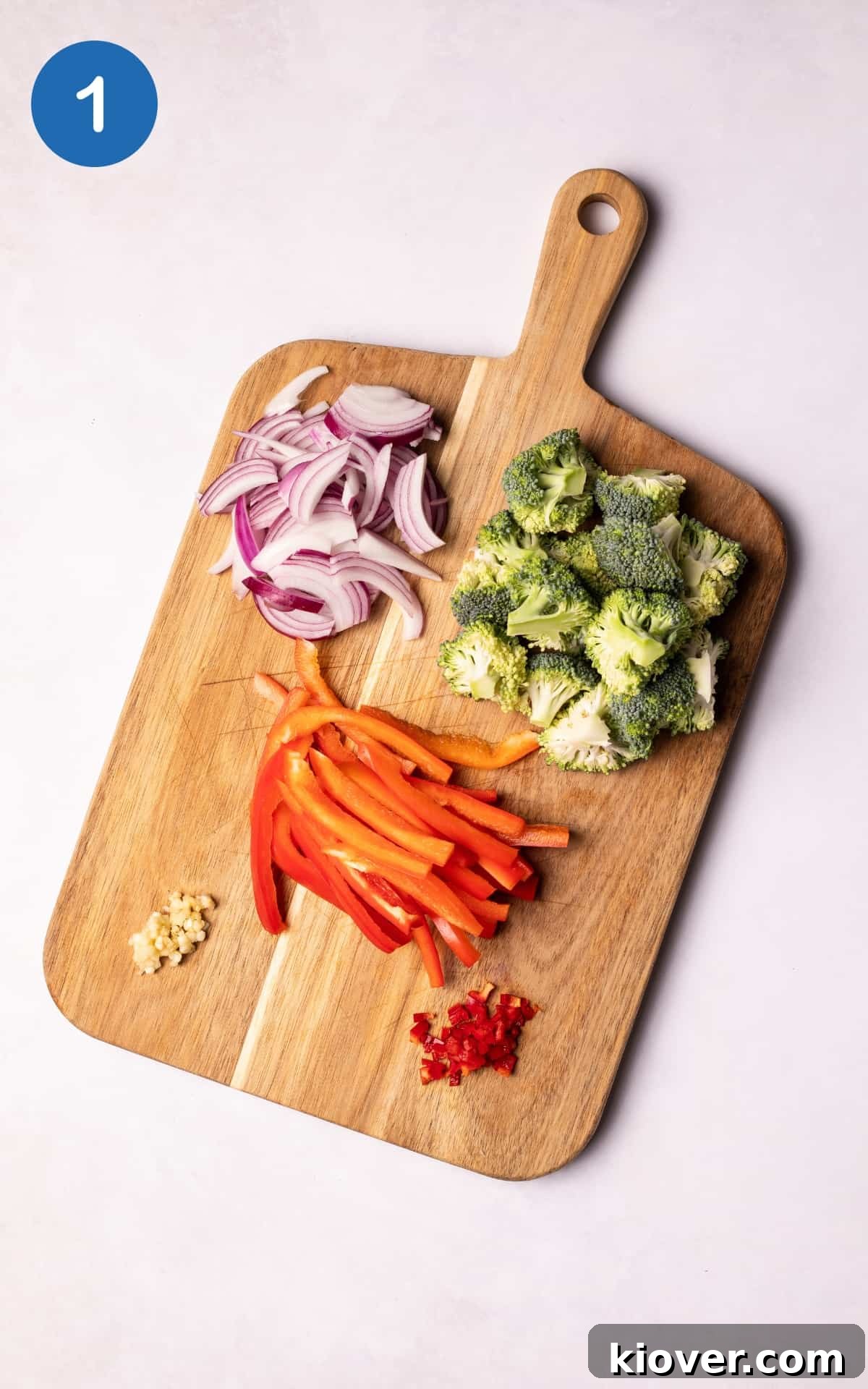 Authentic Vegan Pad Thai Recipe: Flavorful Plant-Based Noodles 4 Vegetables on a wooden chopping board.