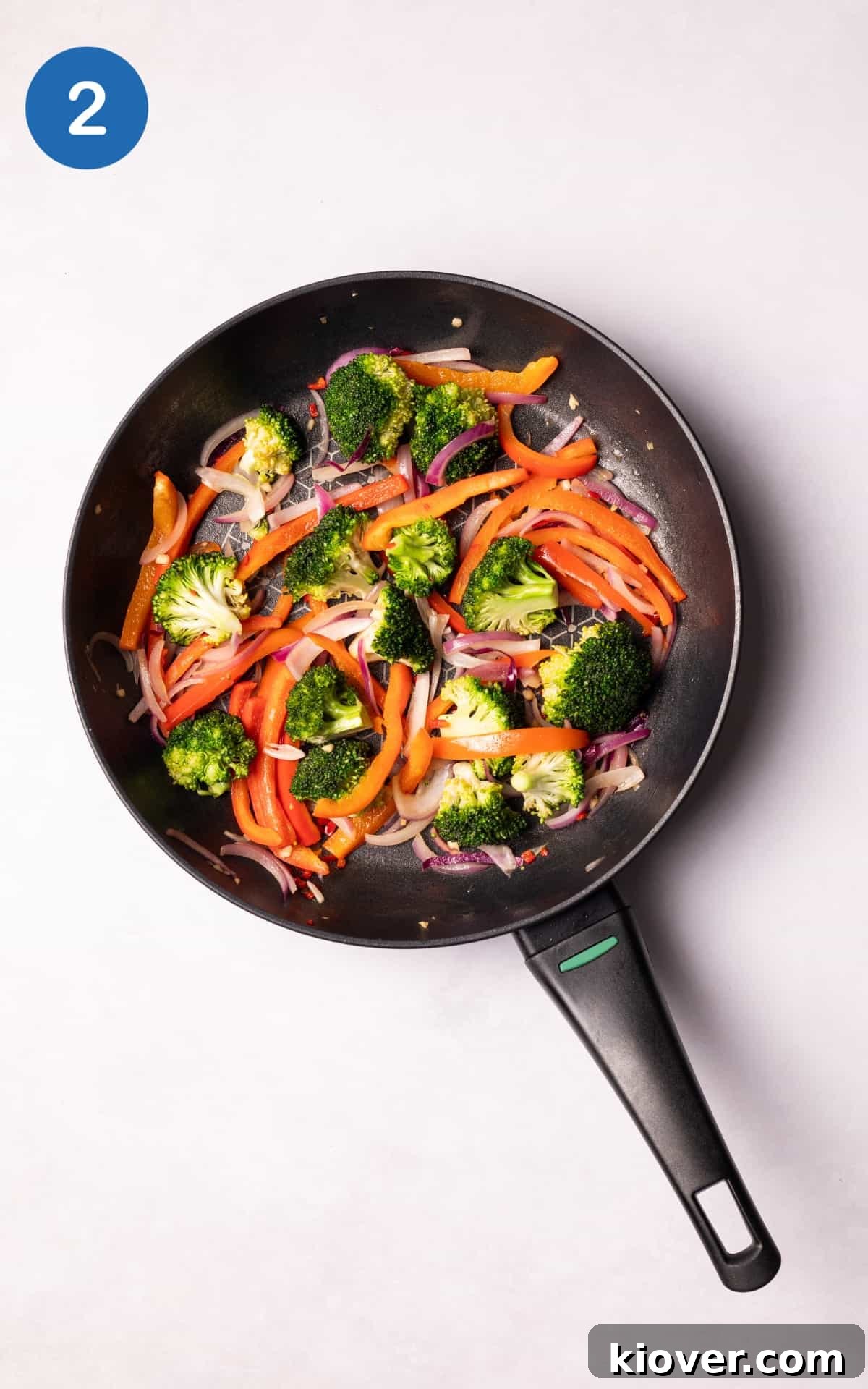 Authentic Vegan Pad Thai Recipe: Flavorful Plant-Based Noodles 5 Vegetables in a non stick pan.