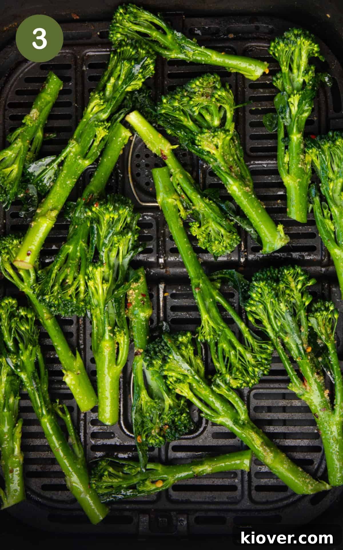 tenderstem broccoli in the air fryer basket.