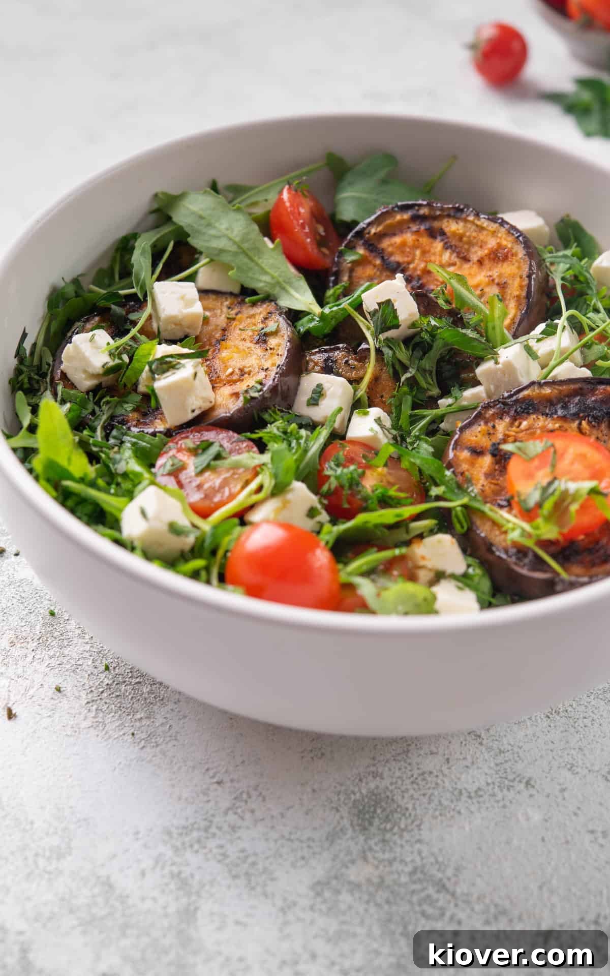 Smoky Roasted Eggplant Salad with Garlic and Herbs 10 grilled eggplant salad with feta, rocket and cherry tomatoes.