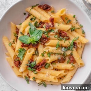Sun dried tomato pasta with fresh basil and parmesan cheese.