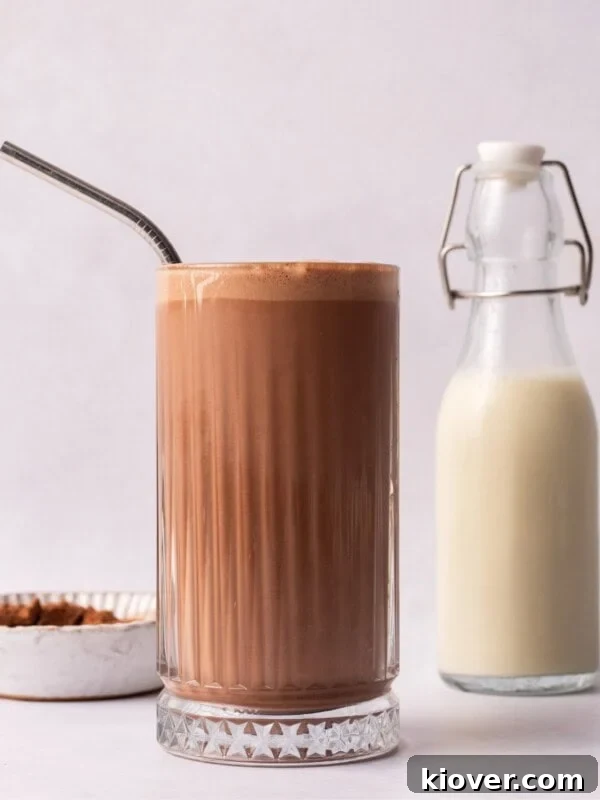 Peanut Butter Milkshake next to milk in a glass bottle.
