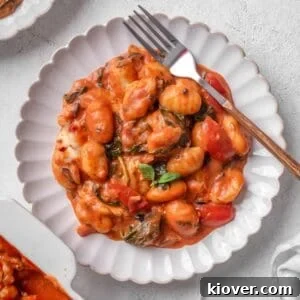 Creamy Baked Gnocchi with Mozzarella and Tomato Sauce 15 Baked gnocchi served on a plate.