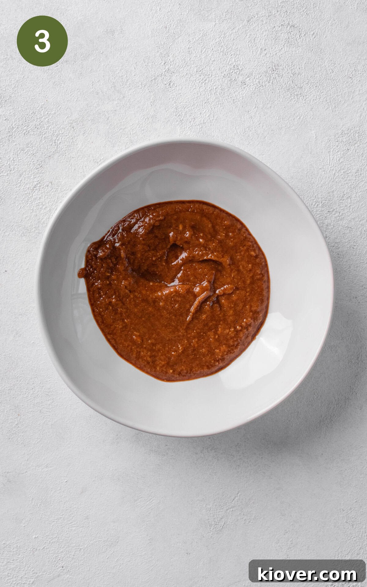 dressing with peanut butter, maple syrup and tamari in a bowl.