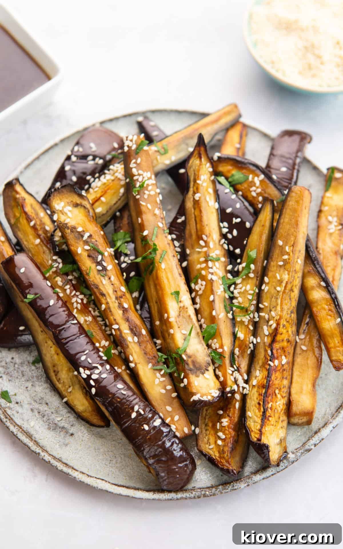 air fryer eggplant sprinkled with sesame seeds.