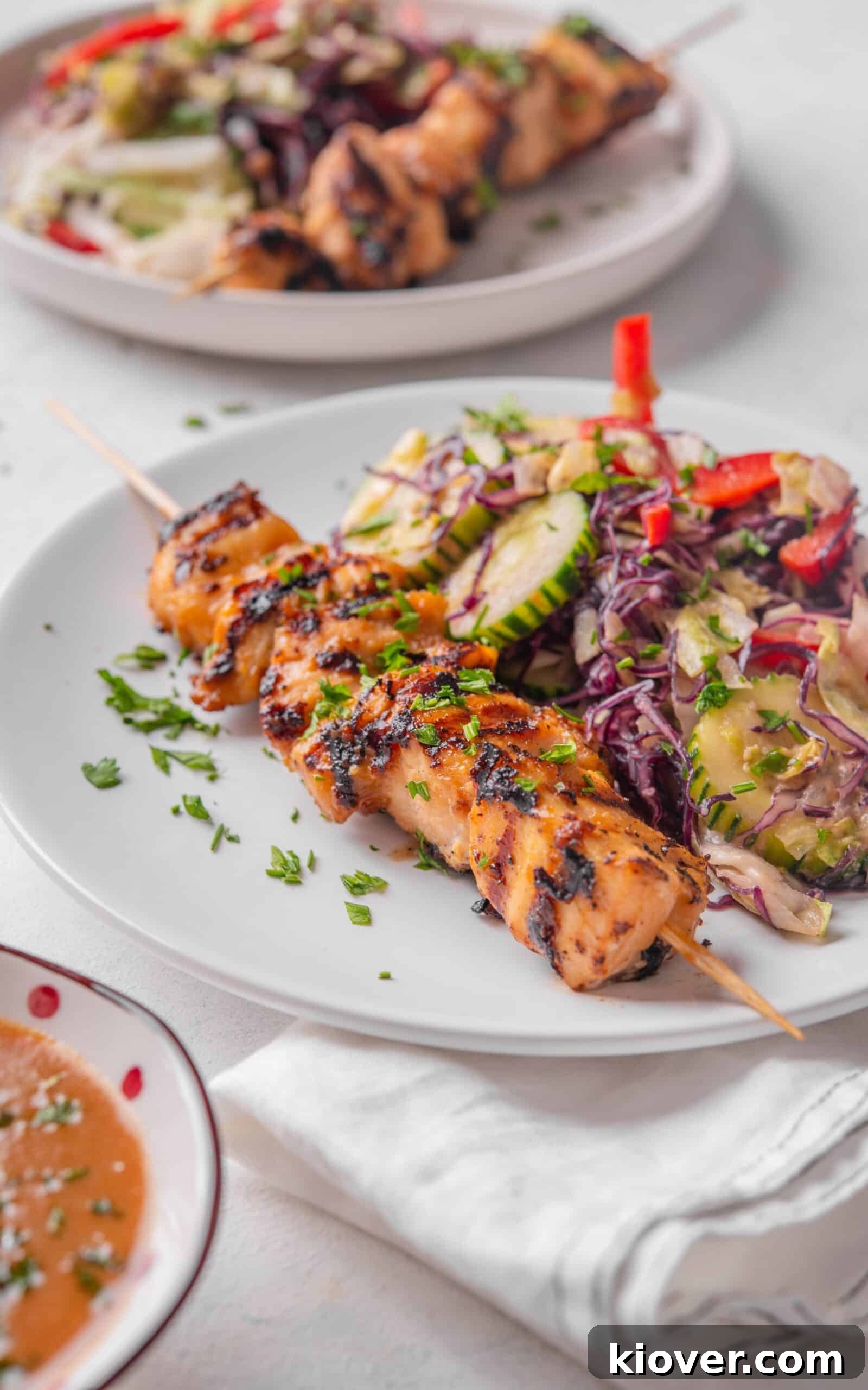 chicken satay salad served on a plate.