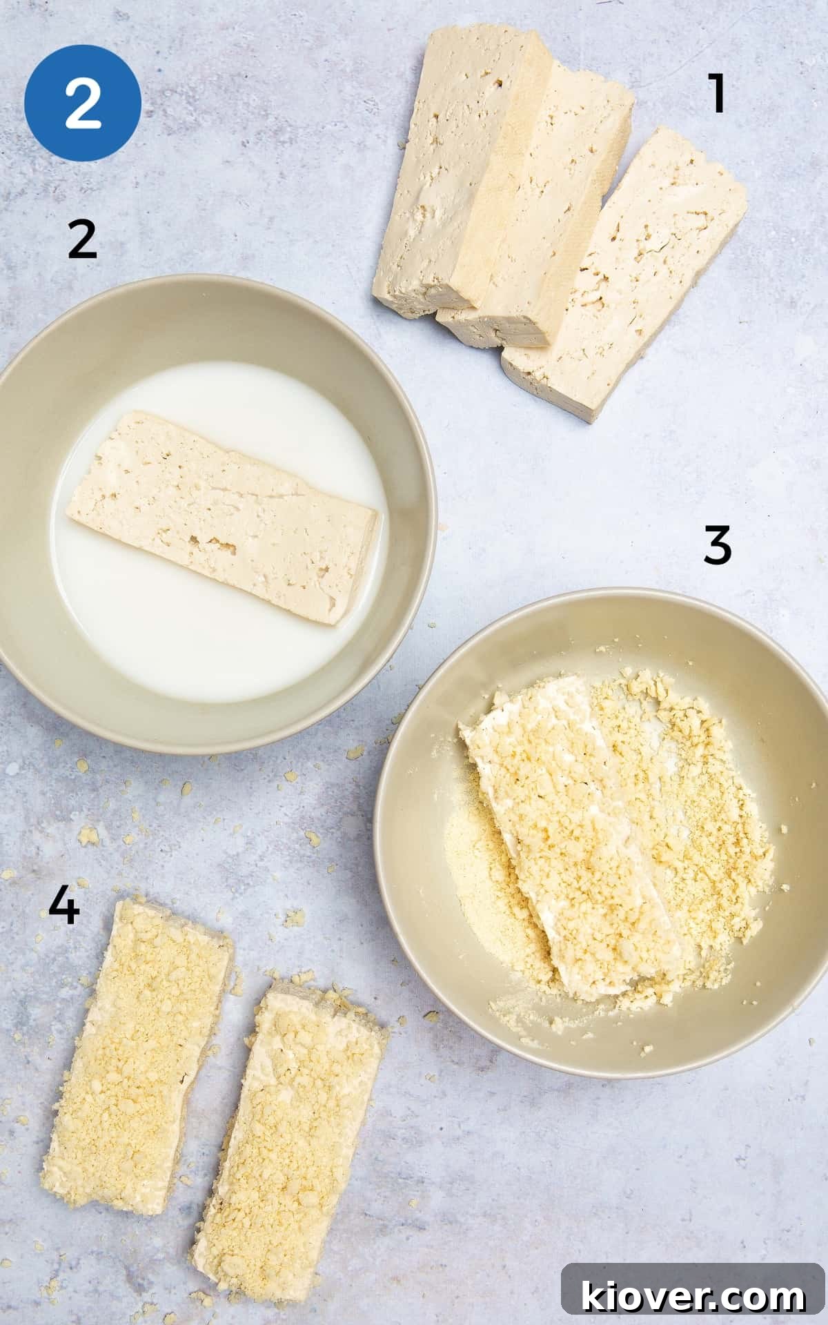 tofu steaks dipped into milk and bowl with breadcrumbs.