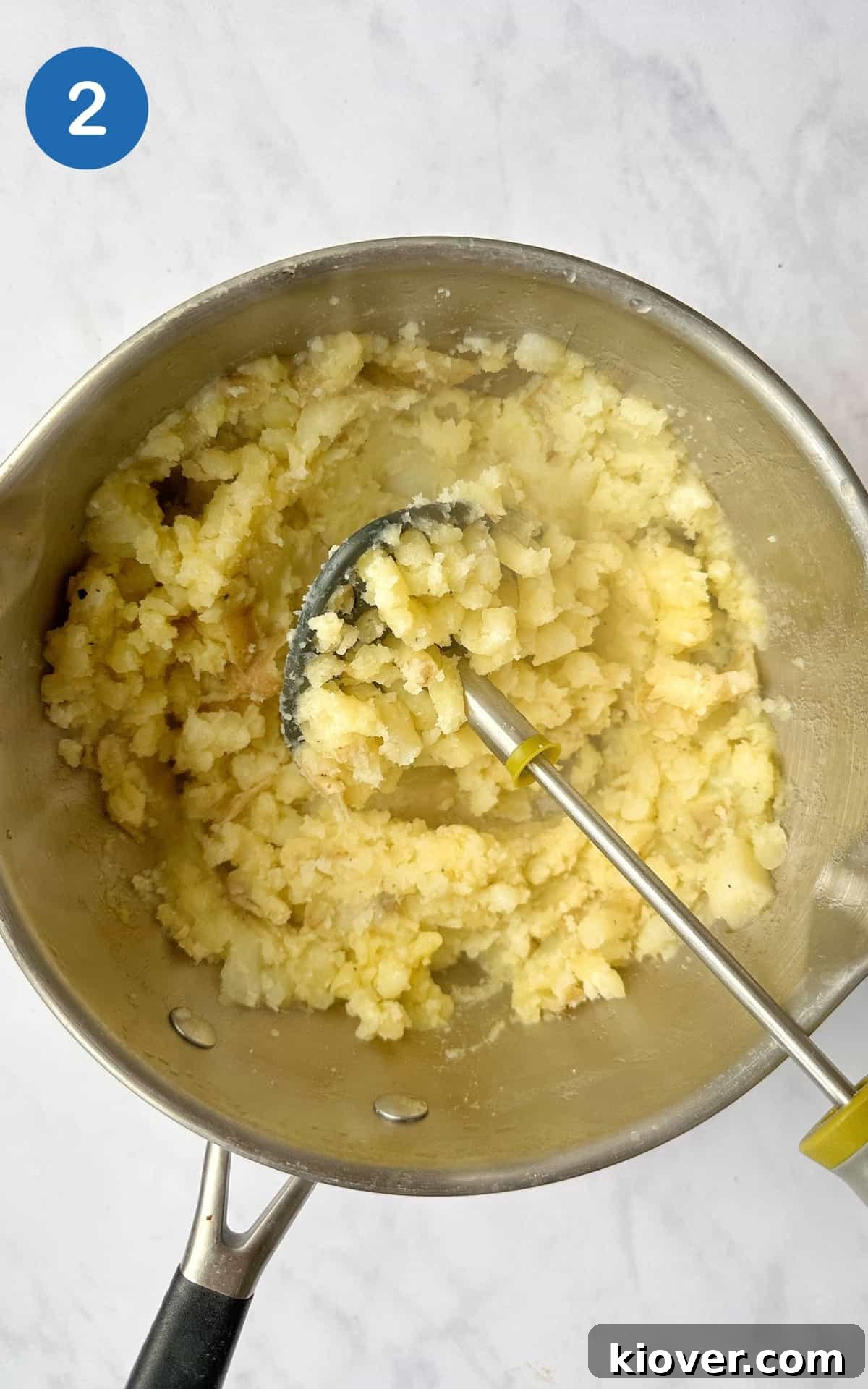White potatoes smashed in a pot.