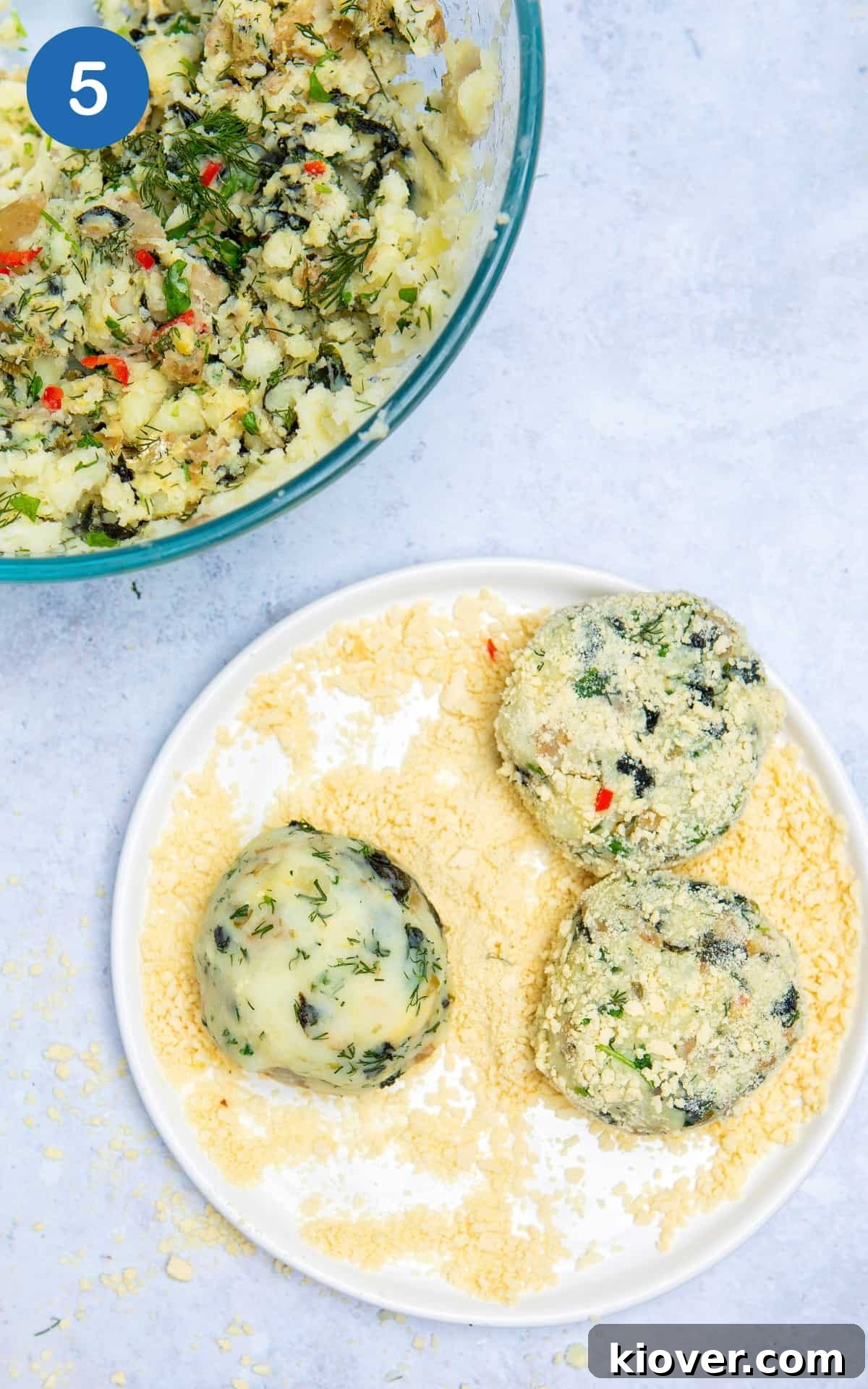 3 Vegan fishcakes on a plate with breadcrumbs.