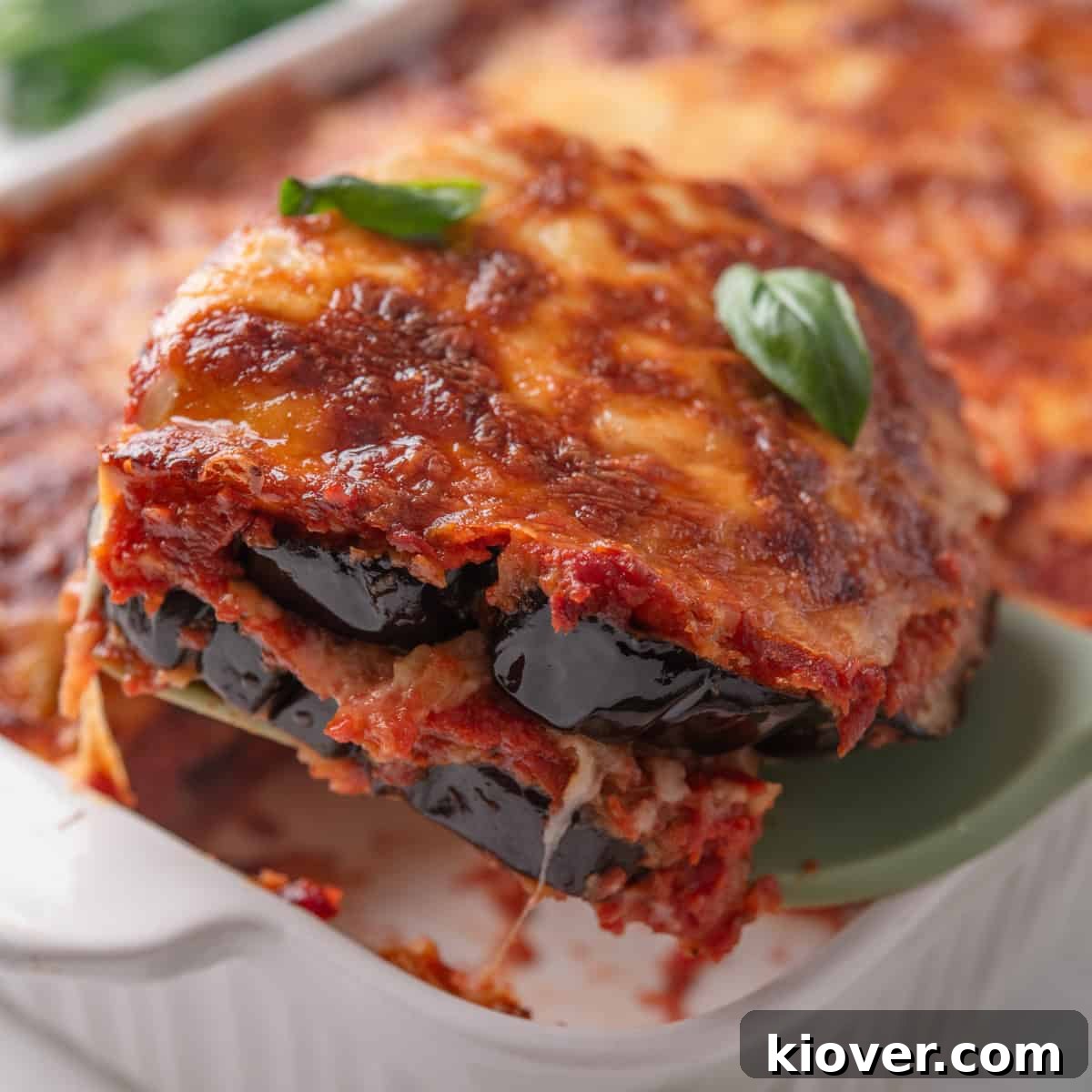 Eggplant Parmigiana Recipe: Classic Italian Melanzane alla Parmigiana 2 Aubergine Parmigiana close up.