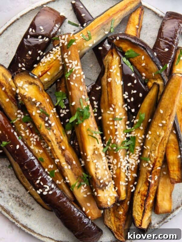 Eggplant Parmigiana Recipe: Classic Italian Melanzane alla Parmigiana 14 Air Fryer Aubergine sprinkled with sesame seeds.