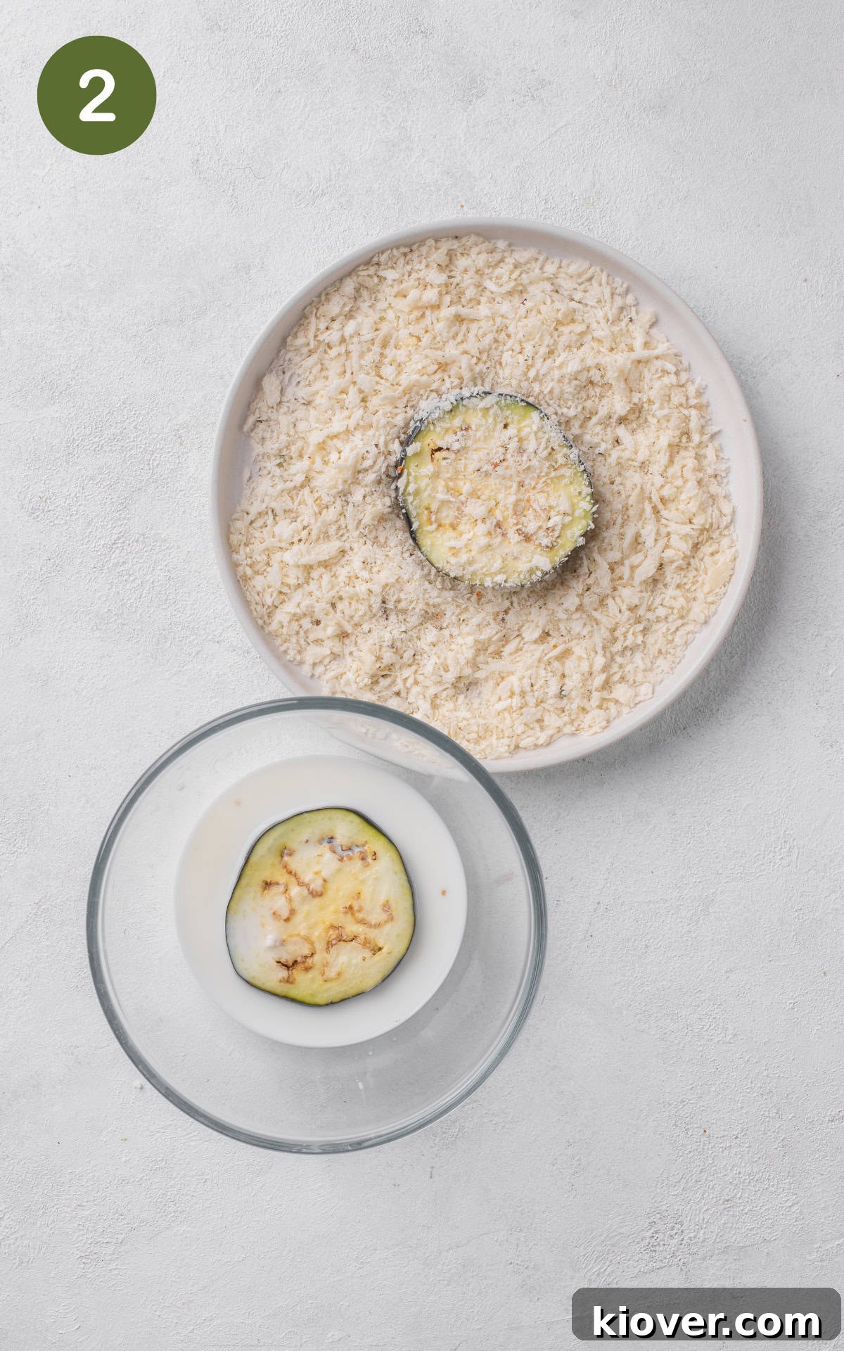 Eggplant Parmigiana Recipe: Classic Italian Melanzane alla Parmigiana 5 aubergine slice dipped in milk and coated with breadcrumbs.