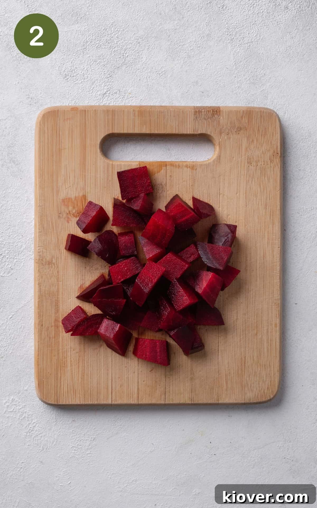 Vibrant Beetroot Hummus Recipe: Creamy & Flavorful Dip 5 pieces of beet on a wooden cutting board.