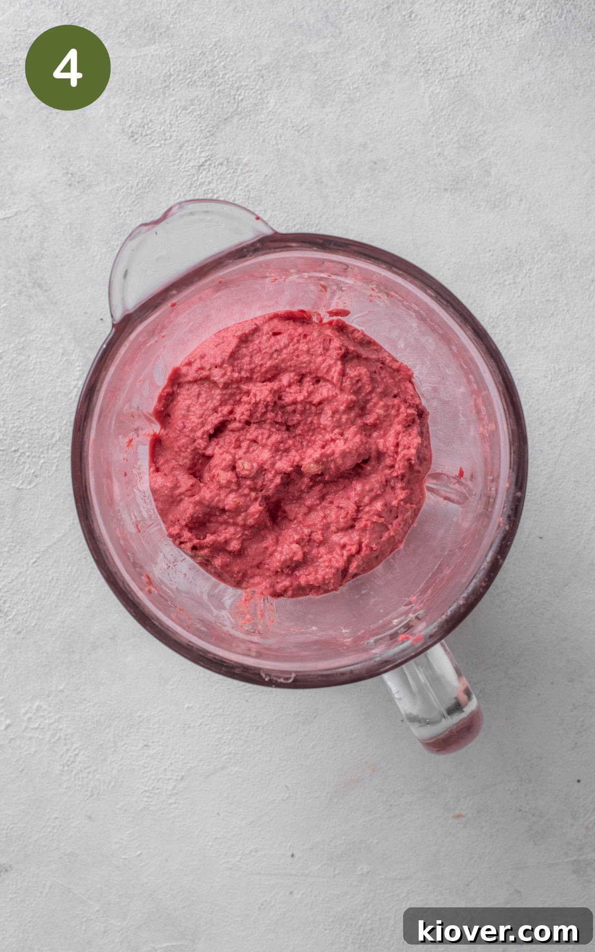 Vibrant Beetroot Hummus Recipe: Creamy & Flavorful Dip 7 blended beetroot hummus in a food processor.