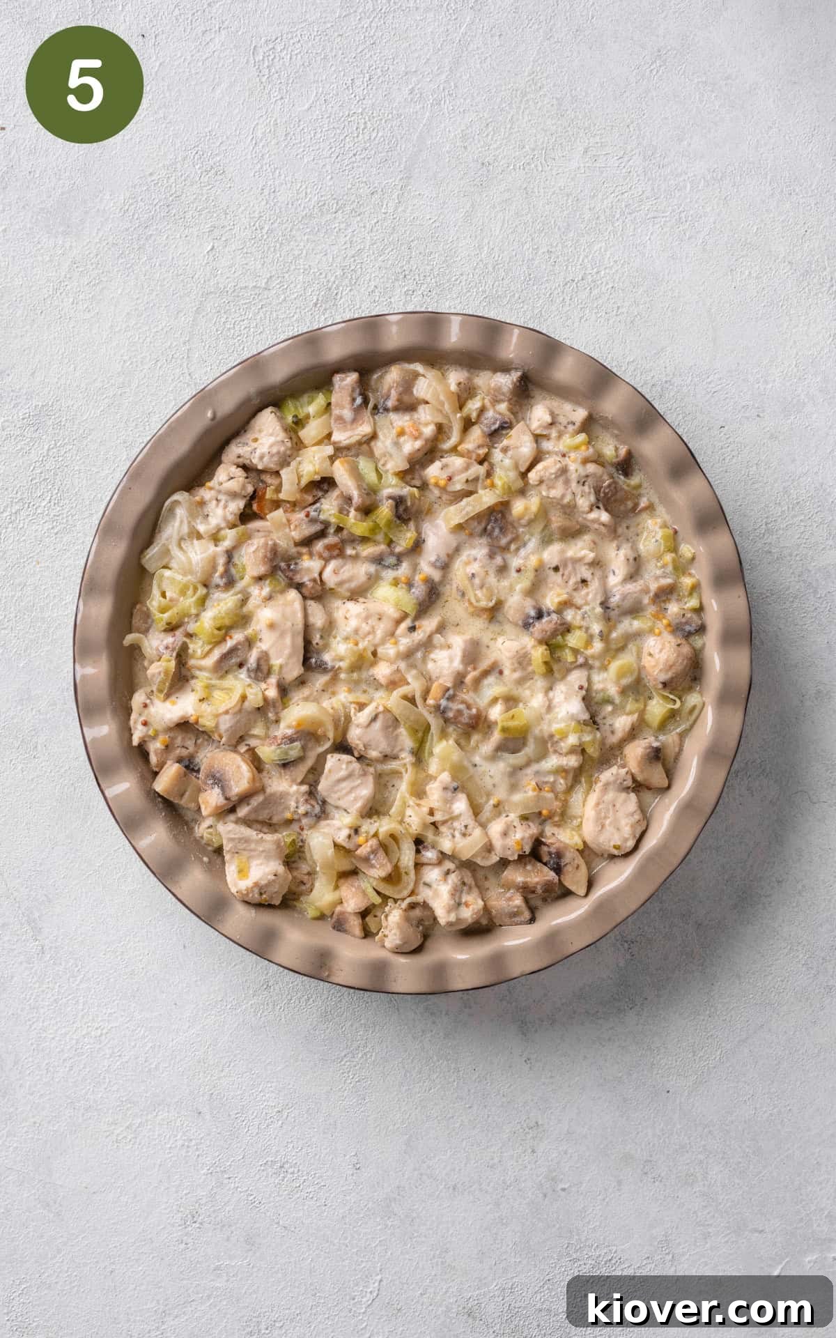 Classic Chicken and Leek Pie Recipe for Comforting Dinner 8 chicken and leek mixture in the pie dish.