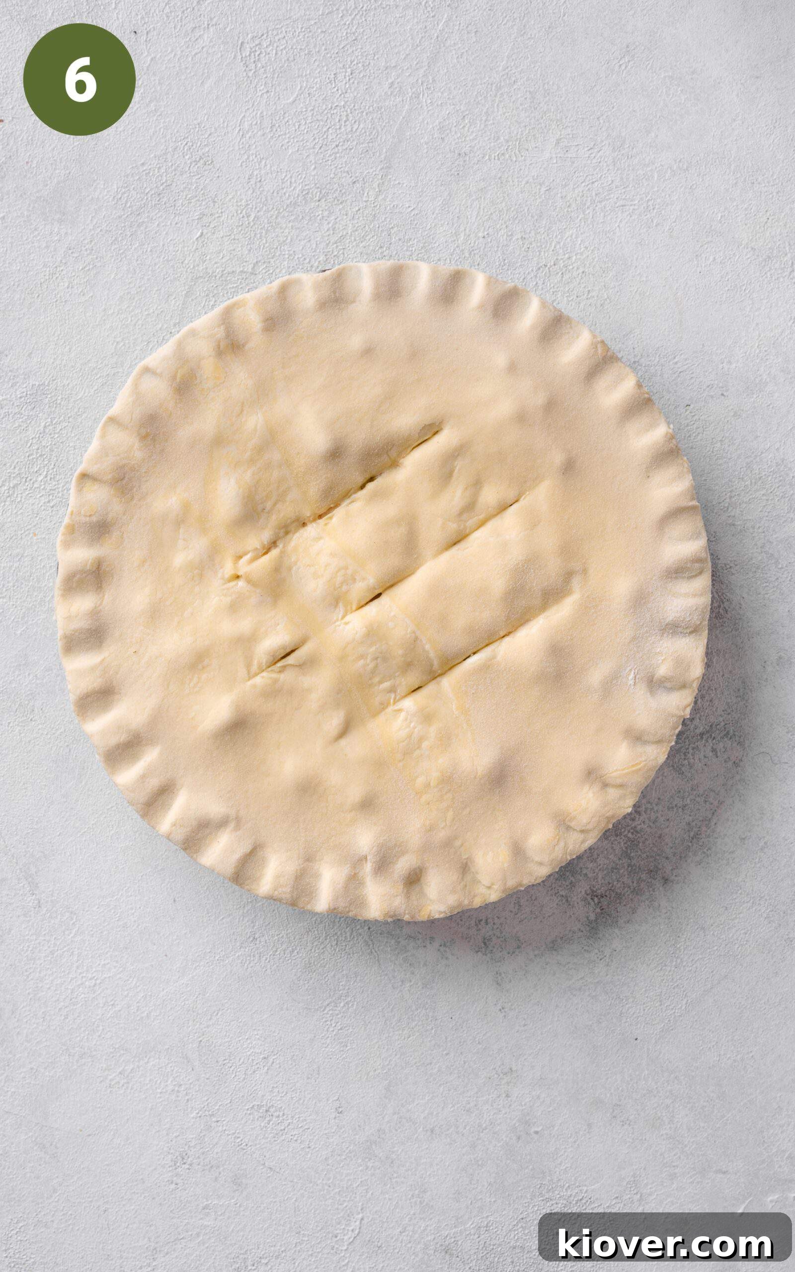 Classic Chicken and Leek Pie Recipe for Comforting Dinner 9 topping chicken and leek mixture with puff pastry.