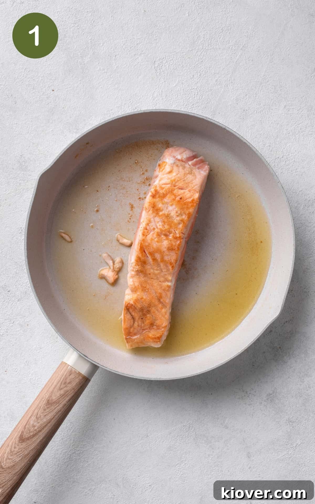 salmon fillet in a frying pan.