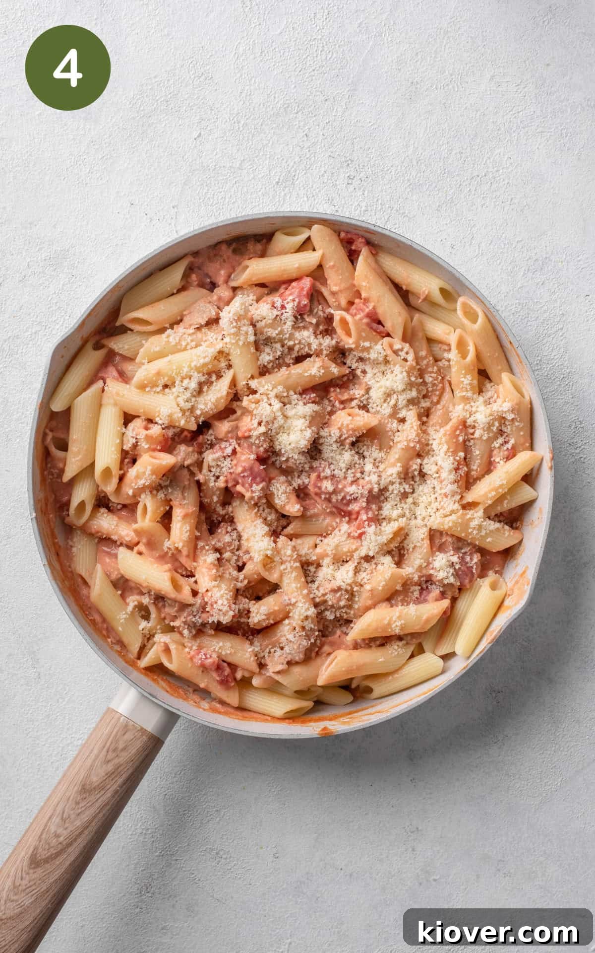 pasta mixed with tomatoes and parmesan cheese.