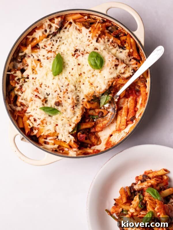 Creamy Chicken Pasta Bake with Melty Cheese and Herbs 12 Vegan Pasta Bake served in a dish and on a plate.