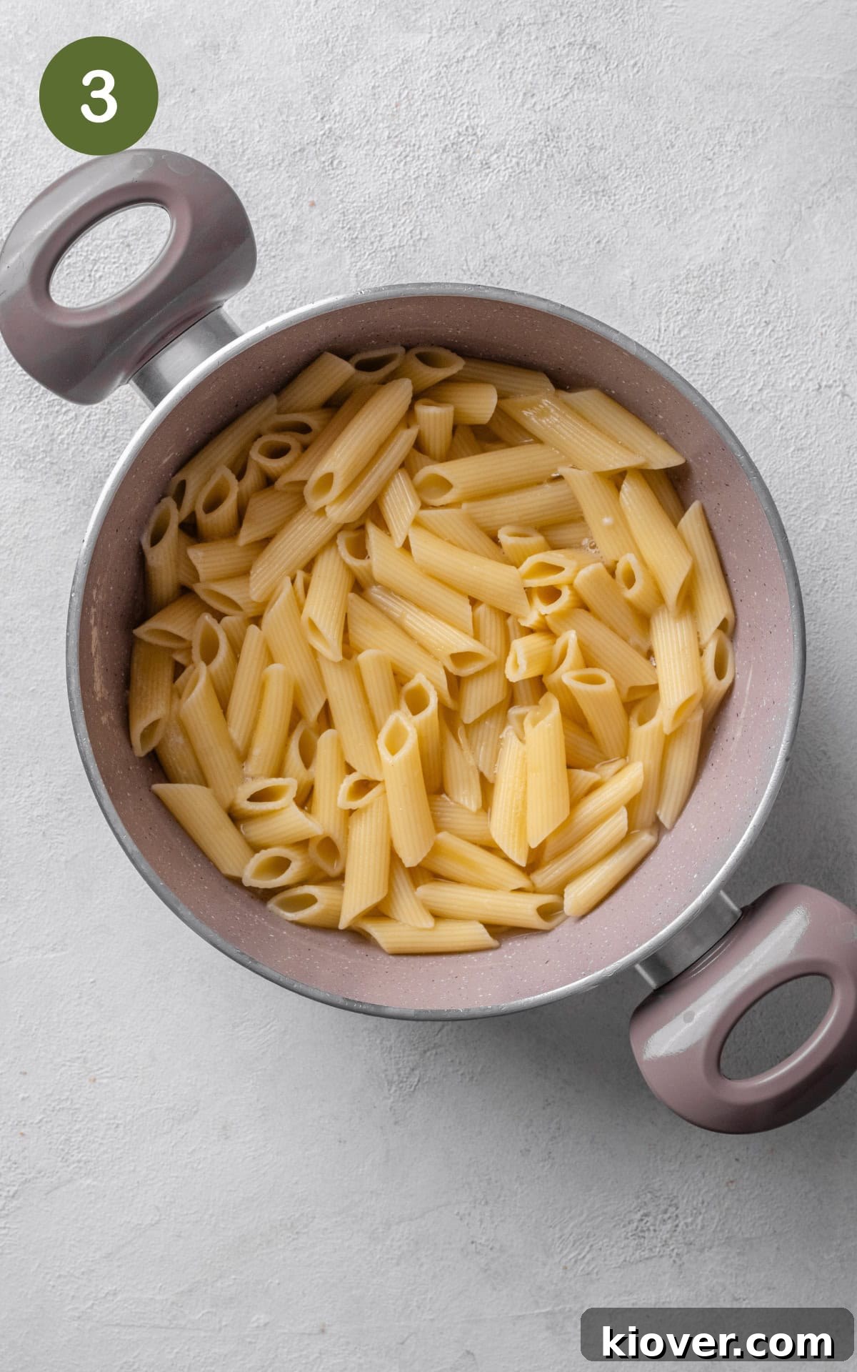 Creamy Chicken Pasta Bake with Melty Cheese and Herbs 6 pasta in a pot of boiling water.