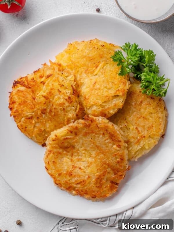 Crispy Potato Waffles Recipe: Homemade Hash Brown Waffles 11 potato rosti served on a plate.