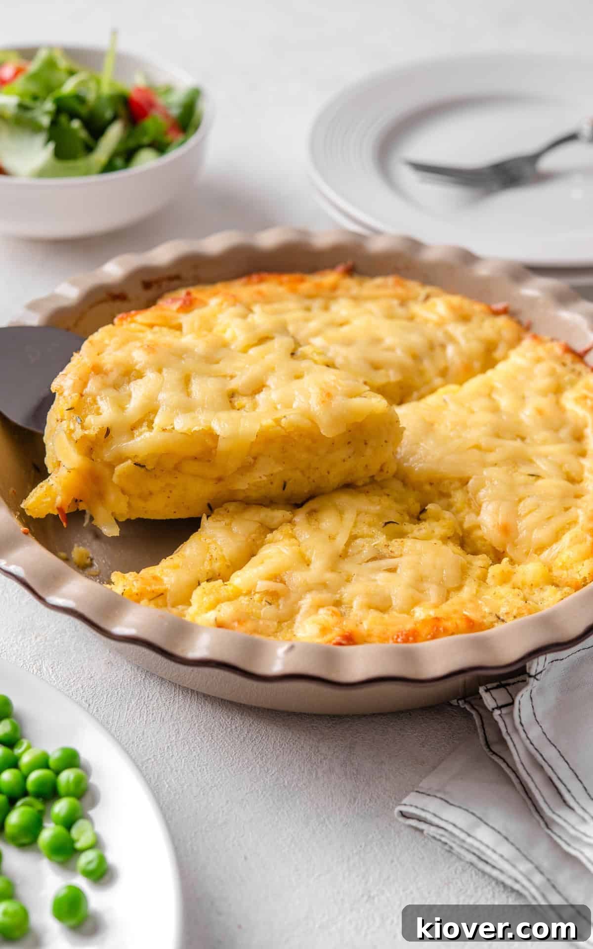 cheesy pie with potatoes in a baking dish.