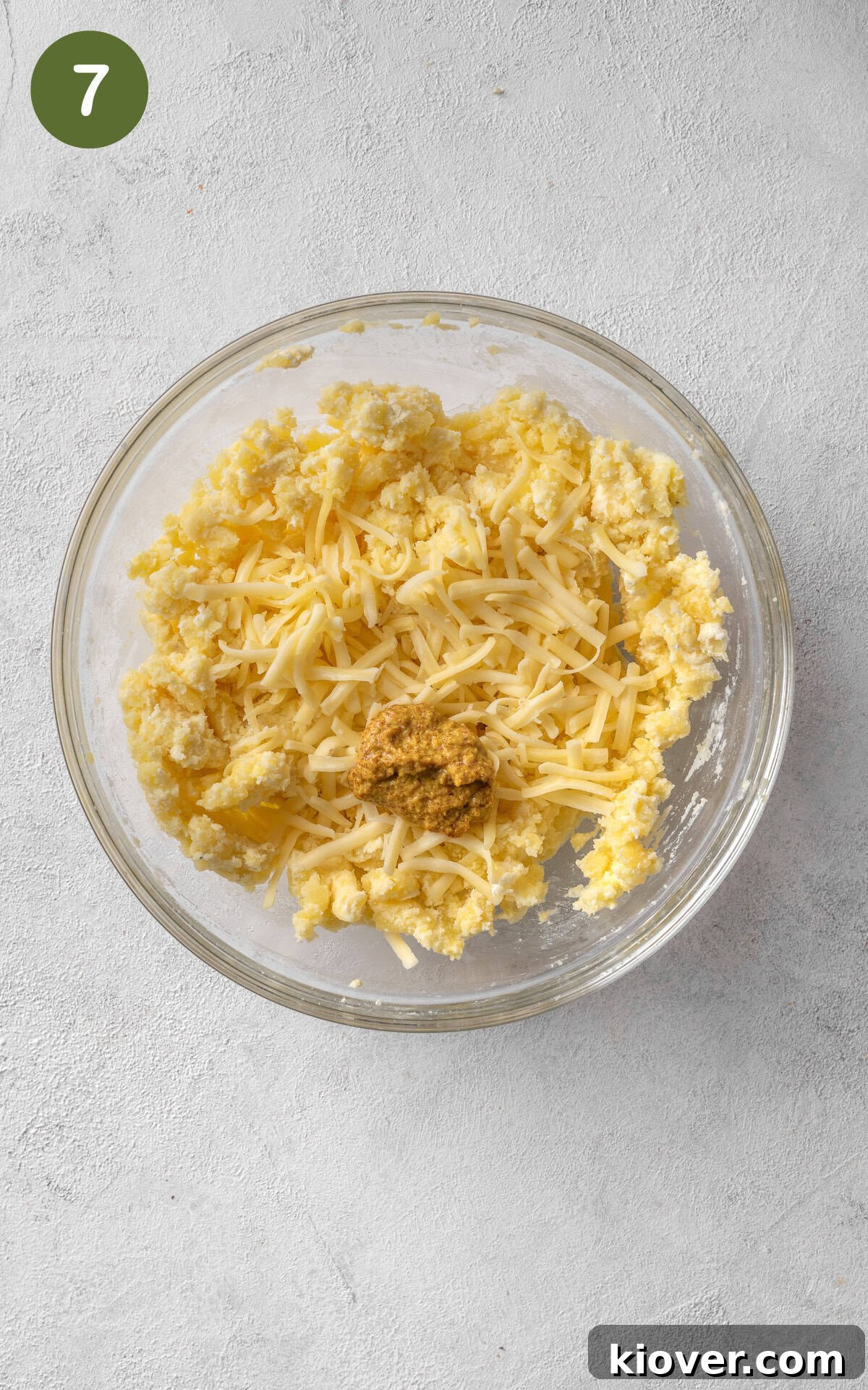 mixing caramelised onions with cheese, potatoes and butter.