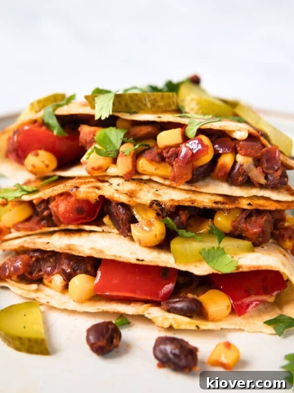Authentic Mexican Soup Recipe: Flavorful Caldo de Res Guide 11 filled black bean quesadillas on a white plate.