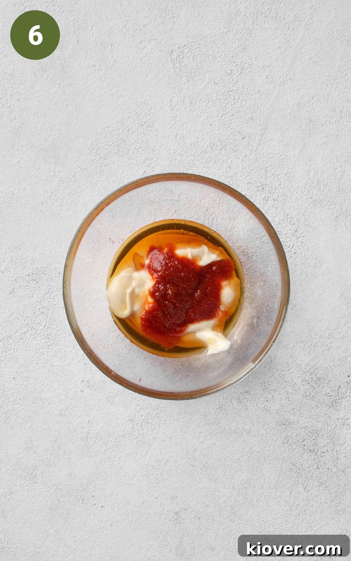 mayonnaise, Sriracha, and maple syrup in a bowl.