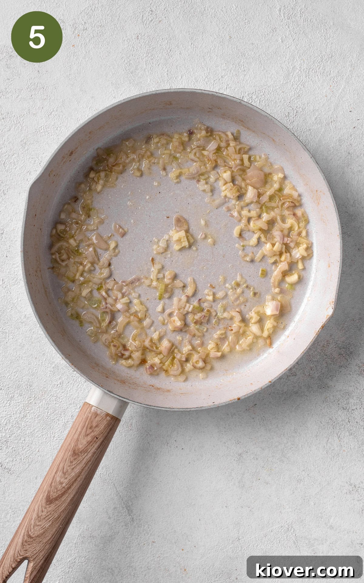 cooking shallots and garlic on a skillet.